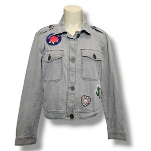 Mossimo Supply Company light grey jean jacket with patches. Medium